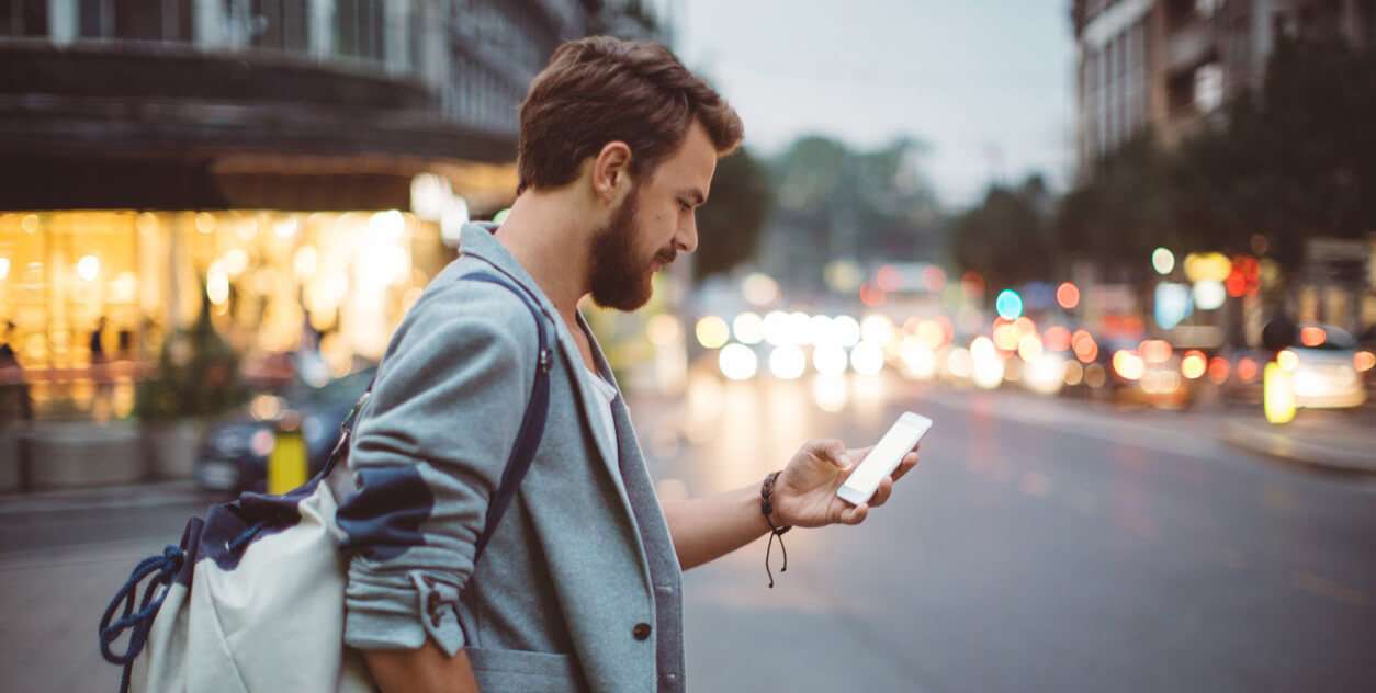 man walking with mobile phone