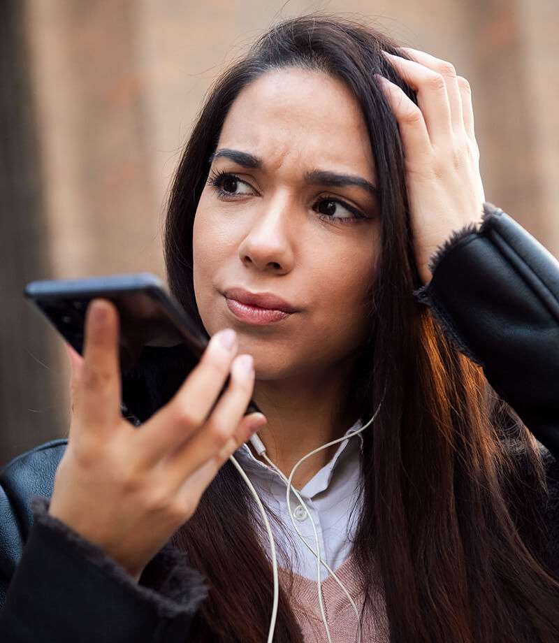 woman on phone with ear buds