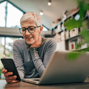 Older woman at home on a mobile phone