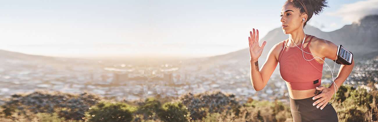 Woman running with mobile armband