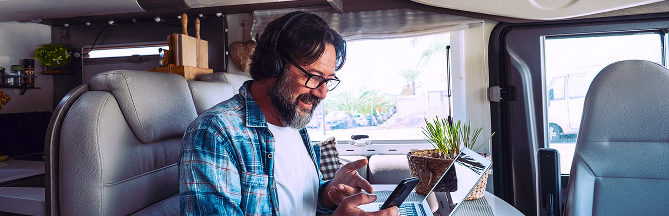 Man on his computer in his rv